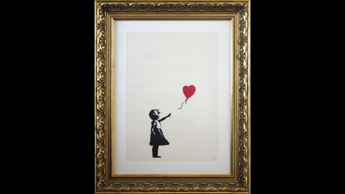 Rubano stampa ‘Ragazza con Palloncino’ di Banksy, incriminate 2 persone